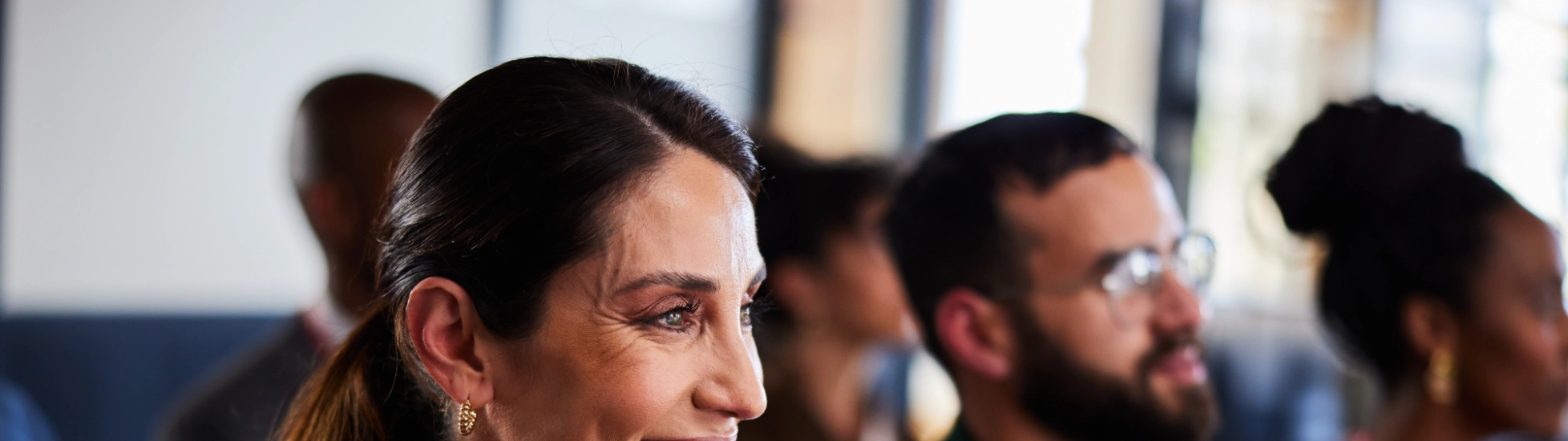 Smiling woman attending a business seminar